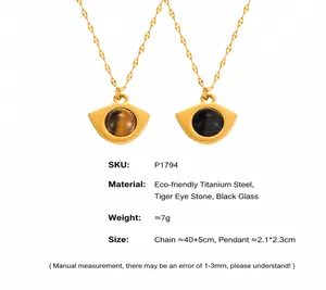 Detail of gold fan-shaped pendant with tiger eye stone on durable titanium steel chain
