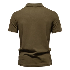 Detail of army green polo shirt with ribbed cuffs and cream white contrast edging trim