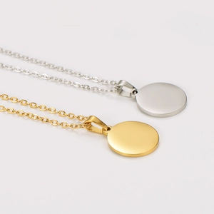Polished stainless steel necklaces with round pendants in gold and silver finishes