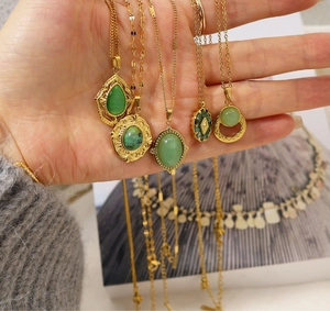 Detailed close-up of 18K gold plated necklaces featuring diverse green natural stone pendants