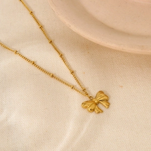 Collier minimaliste à pendentif nœud en acier doré 18K avec chaîne perlée pour femmes