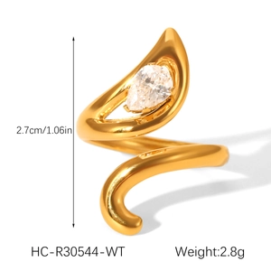 Detail view of a gold spiral ring featuring a teardrop zircon and size specifications
