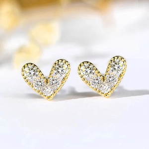Exquisite gold heart stud earrings featuring micro-pave cubic zirconia and beaded edges