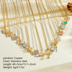 Collection of stainless steel heart necklaces with colorful zircon pendants on silk