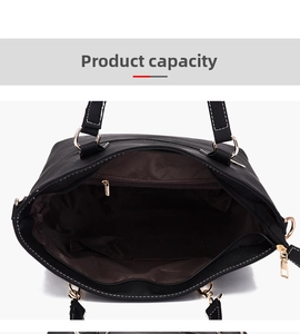 Internal view of black leather tote bag showing large capacity and zipper pocket