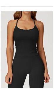 Detail of premium black ribbed seamless yoga set featuring thin straps and high waist leggings