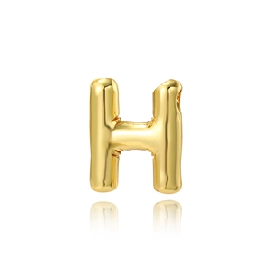 Detailed macro view of 18K gold-plated balloon letter H pendant with polished finish