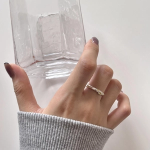 925 sterling silver irregular hammered ring with small yellow gemstone on hand