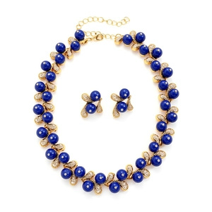 Elegant gold necklace and earring set with blue acrylic beads and crystal leaf details