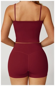 Detail view of burgundy yoga set with double straps and V-shape booty seam design