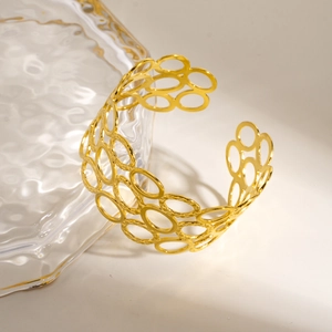 Modern hollow textured stainless steel cuff bracelet in polished gold finish