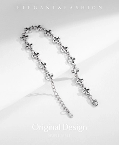 Detail of s925 silver cross bracelet showing the lobster clasp and adjustable chain