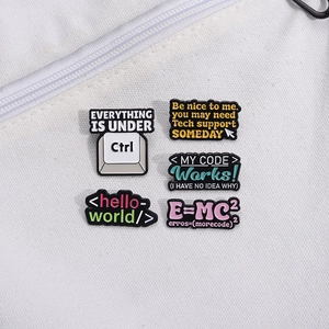 5-piece colorful enamel pin set with programmer motifs and tech slogans on white canvas