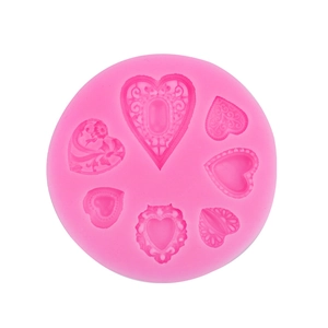 Moule en silicone rose avec motifs de cœurs en relief pour décoration de gâteaux