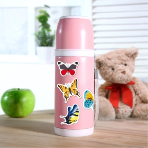 Close-up of colorful cartoon butterfly stickers on a pink children's thermal water bottle