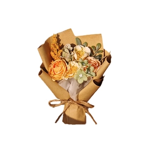 Mini artificial silk rose bouquet in brown kraft paper wrapping with jute bow decoration