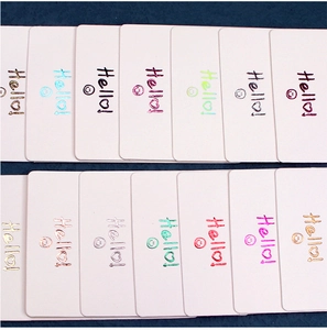 Macro view of kraft paper jewelry display cards with colorful hot-stamping foil text