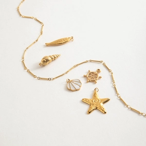 18K gold plated stainless steel handmade chain with five ocean theme charms on white background