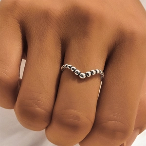 Macro detail of S925 sterling silver beaded wave ring with vintage Thai silver finish