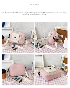Detailed views of pink canvas crossbody bucket bag with cherry charm and cream pocket