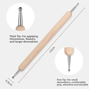 Detailed view of dual-ended wood handle stylus tool for clay sculpting and embossing