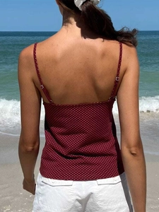 Rear view of red polka dot camisole with thin straps and breathable fabric