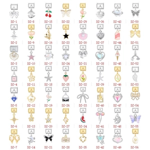Grid view of DIY stainless steel charm pendants in various shapes with enamel and rhinestones