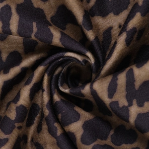 Macro view of leopard print fabric texture with brown and black pattern details