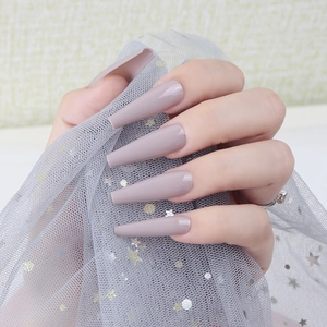 Detail of long ballerina nails in glossy morandi grey purple showing a tapered shape
