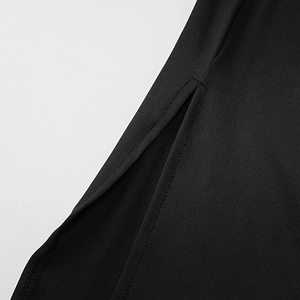 Detail view of the black dress side slit featuring high-quality flat seam stitching