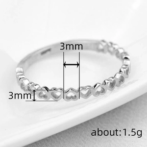 Minimalist silver heart-shaped hollow ring for women featuring continuous cut-out patterns