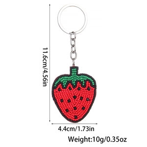 Detailed view of handmade beaded strawberry keychain with 11.6cm length and weight specs
