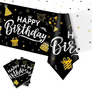 Detail of navy blue and gold Happy Birthday tablecloth with neon balloon patterns