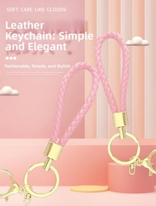 Detail of pink woven PU leather keychains with elegant gold-tone metal hardware
