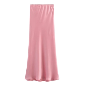 Detail shot of pink satin midi skirt showing smooth silk texture and fabric luster