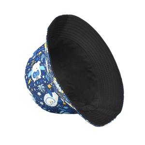 Detail of navy blue canvas bucket hat with cartoon penguin print and black lining