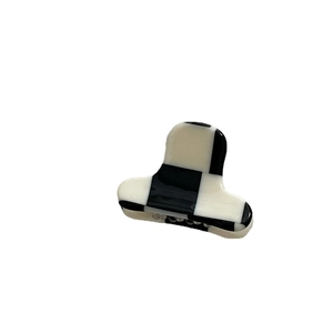 Mini acetate hair claw clip featuring a classic black and white checkerboard pattern