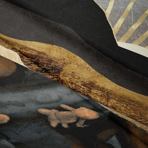 Macro shot showing the soft velvet texture and detailed mountain print of the tapestry