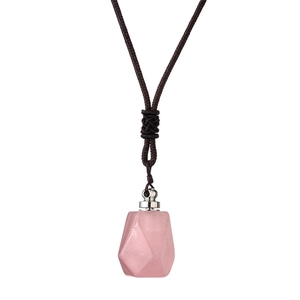 Pink crystal stone pendant necklace with brown woven cord and silver fastener