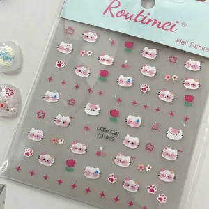 Detail of white cat nail stickers with small flowers and tulips for professional manicures