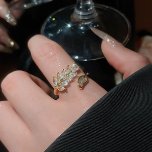 Detailed view of leaf-shaped marquise cut zircon stones on adjustable gold plated ring