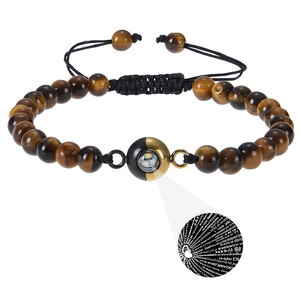 Detailed projection bead showing I Love You in 100 languages on Tiger Eye bracelet