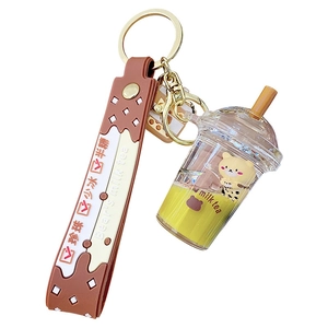 Cartoon bear milk tea keychain with yellow liquid, black pearls and brown rubber strap