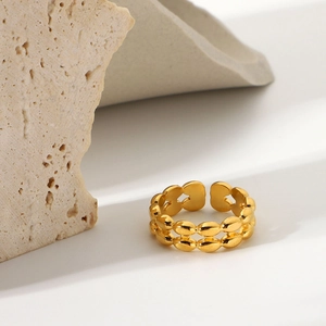 Detail of 18K gold stainless steel double-layered bean open ring on stone decor