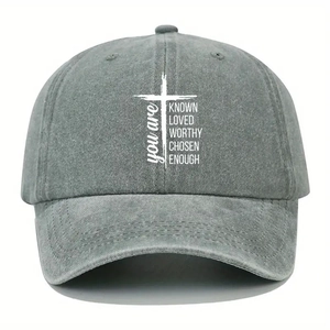 Washed dark gray baseball cap with white cross and motivational text print on front