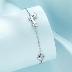 Cute 925 sterling silver dachshund and paw print charm bracelet for women in minimalist style