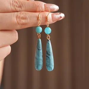 Bohemian vintage drop earrings with blue marble teardrop pendants and golden hooks