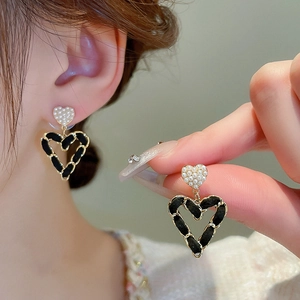 Vintage heart-shaped earrings with black woven leather chain and faux pearls