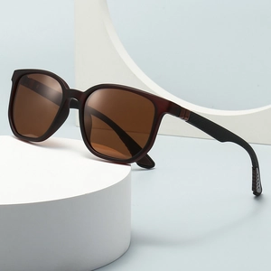 Fashionable dark red-brown polarized sunglasses on a minimalist geometric display stand