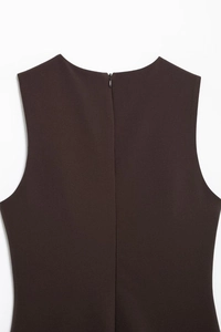 Close-up of the back of a brown sleeveless dress with an invisible zipper closure